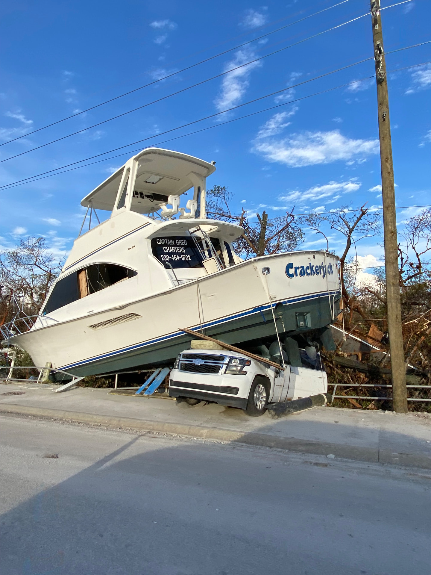 Boat atop a truck after Hurricane Ian in Fort Myers, Florida, October 2022